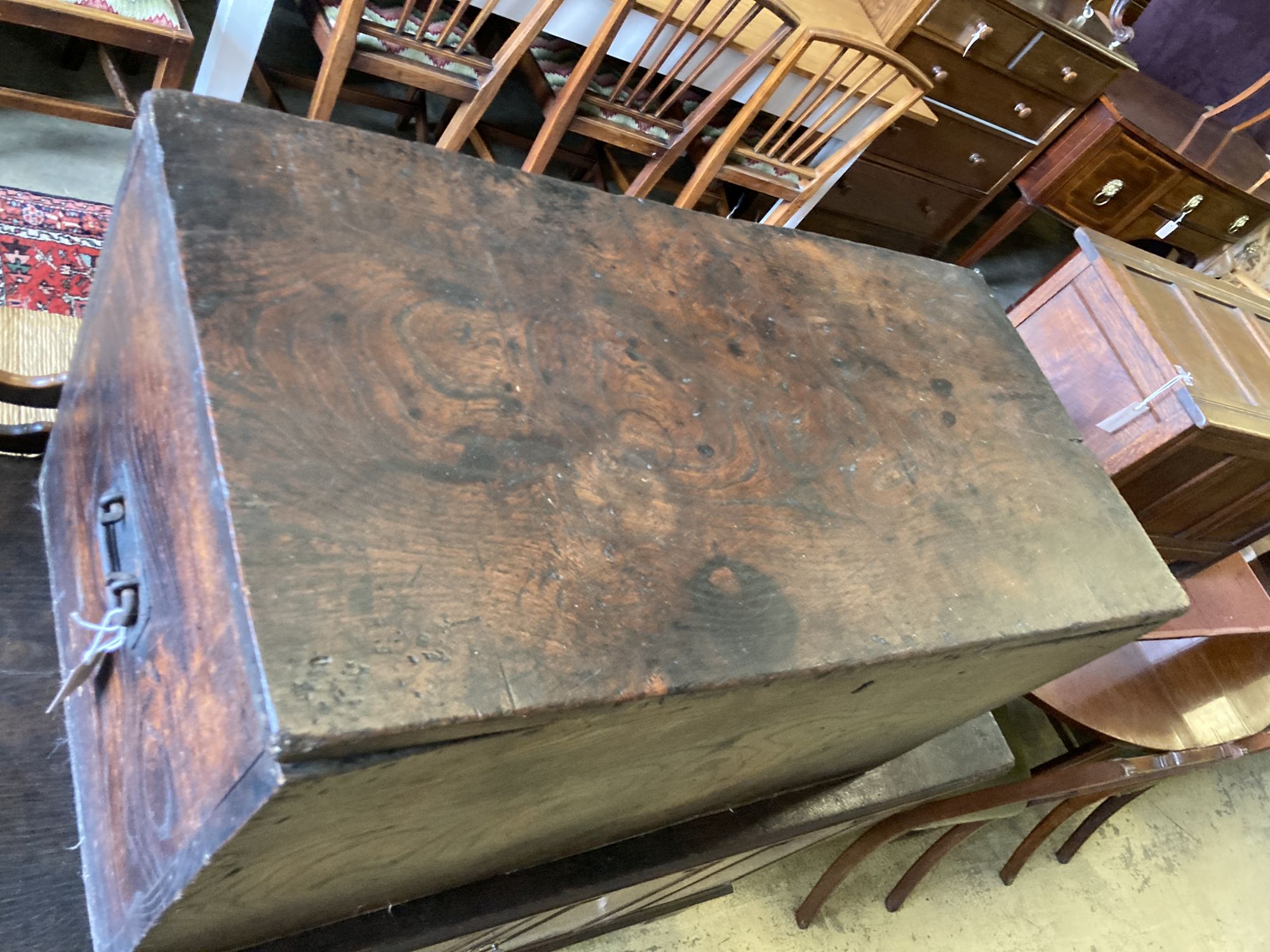 A 19th century elm trunk, with side carrying handles, length 89cm, depth 44cm, height 46cm